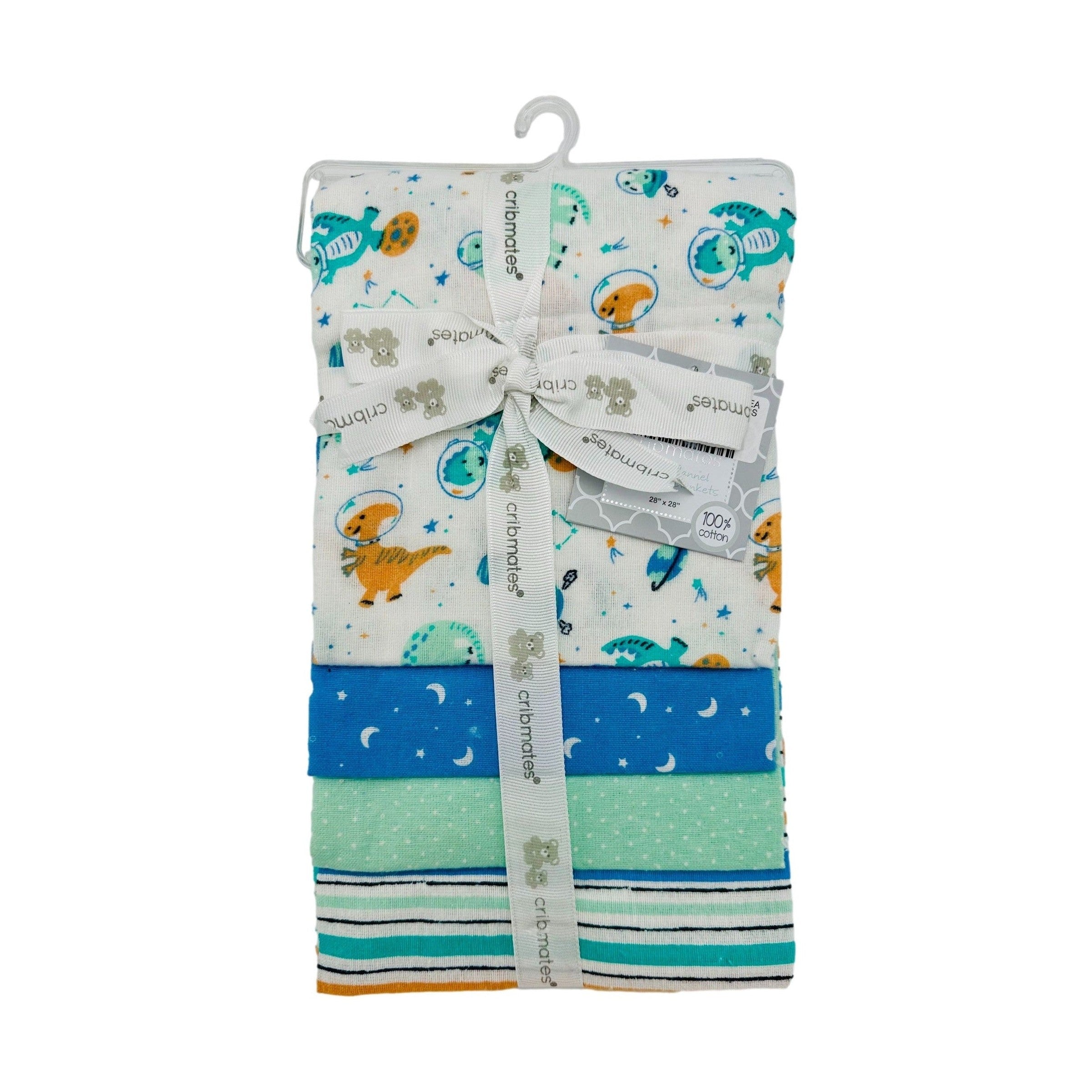 Stacked baby flannel blankets with space dinosaur print and stripe, polka dot, and moon/star patterns, tied with branded ribbon, hanging on a hook.
